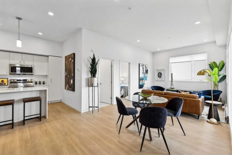 Living Room - Generous Windows, Balcony or Patio, Luxury Vinyl Plank Flooring, Air Conditioning in Each Suite, Open-Concept Layout
