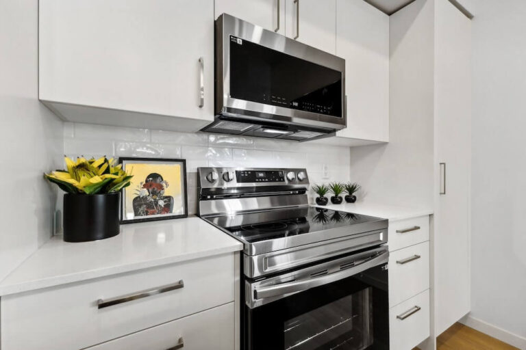 Kitchen - Quartz Countertops, Stainless Steel Appliances, Sleek Fixtures Throughout, Open-Concept Layout, Pull-Out Drawers
